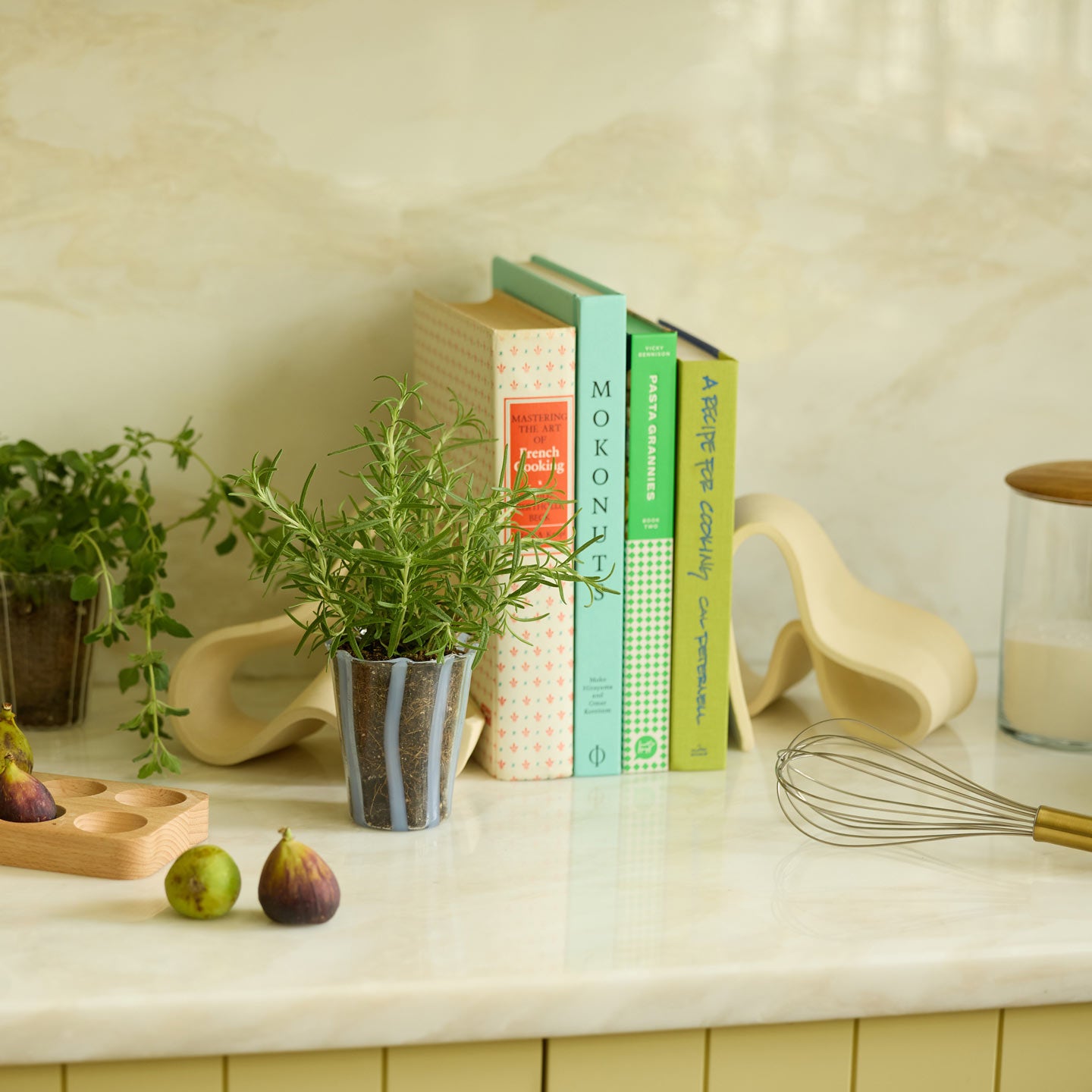 Kitchen counter vignette with cookbooks.