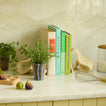 Kitchen counter vignette with cookbooks.