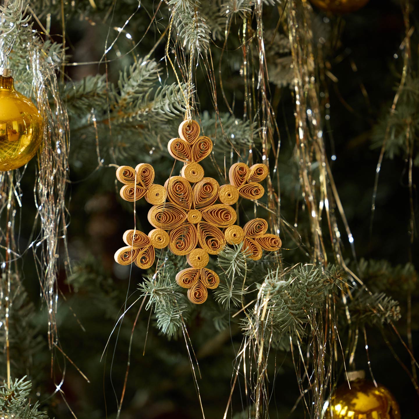 Quilled Snowflake Ornament on tree