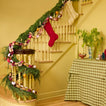 Stairway with garlands and stockings.