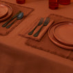 Essential Dinner Napkins in Terracotta on table.
