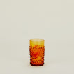 Hobnail Tumbler in Amber filled with water and fruit.