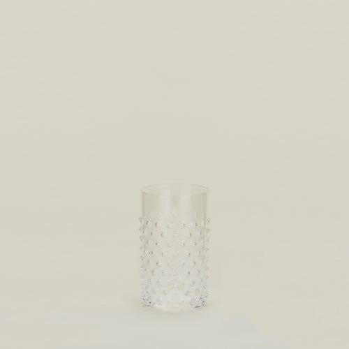 Textured clear glass tumbler.
