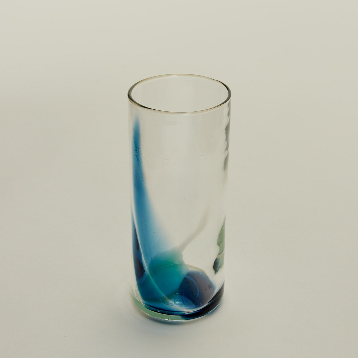 Close up of Blown Glass Highball in Sky and Peacock.