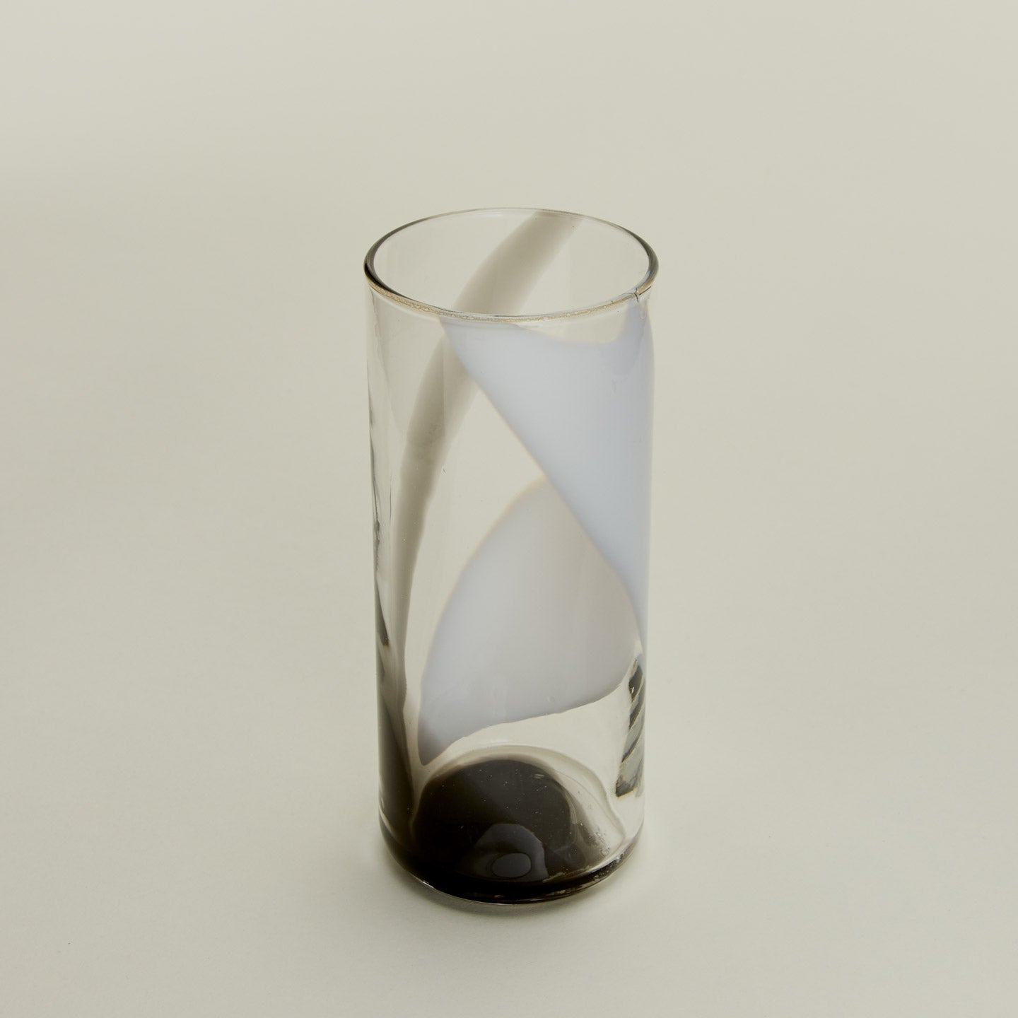 Close up of Blown Glass Highball in White and Grey.