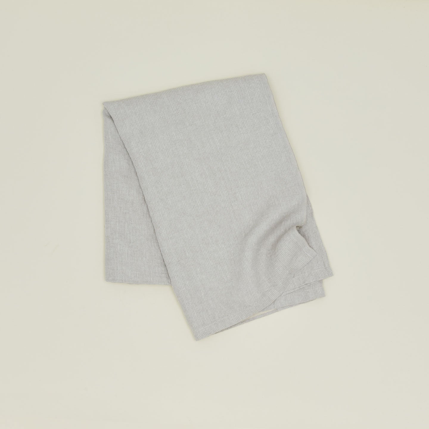A Linen Washed Waffle Throw Blanket in natural.