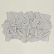 A Linen Washed Waffle Throw Blanket in natural.