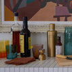Party bar with shaker, jigger, and Essential Glass in Peacock.