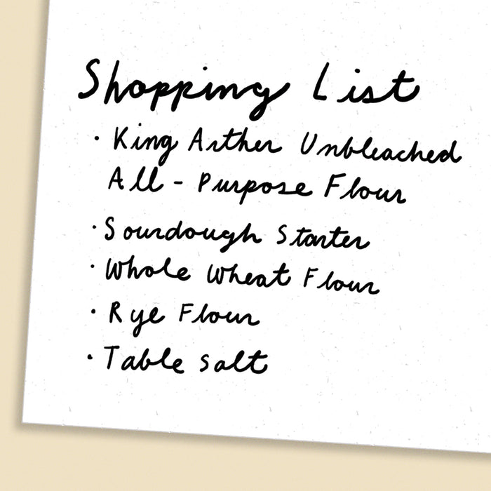 Handwritten shopping list including King Arthur Unbleached All-Purpose Flour, sourdough starter, whole wheat flour, rye flour, and table salt.