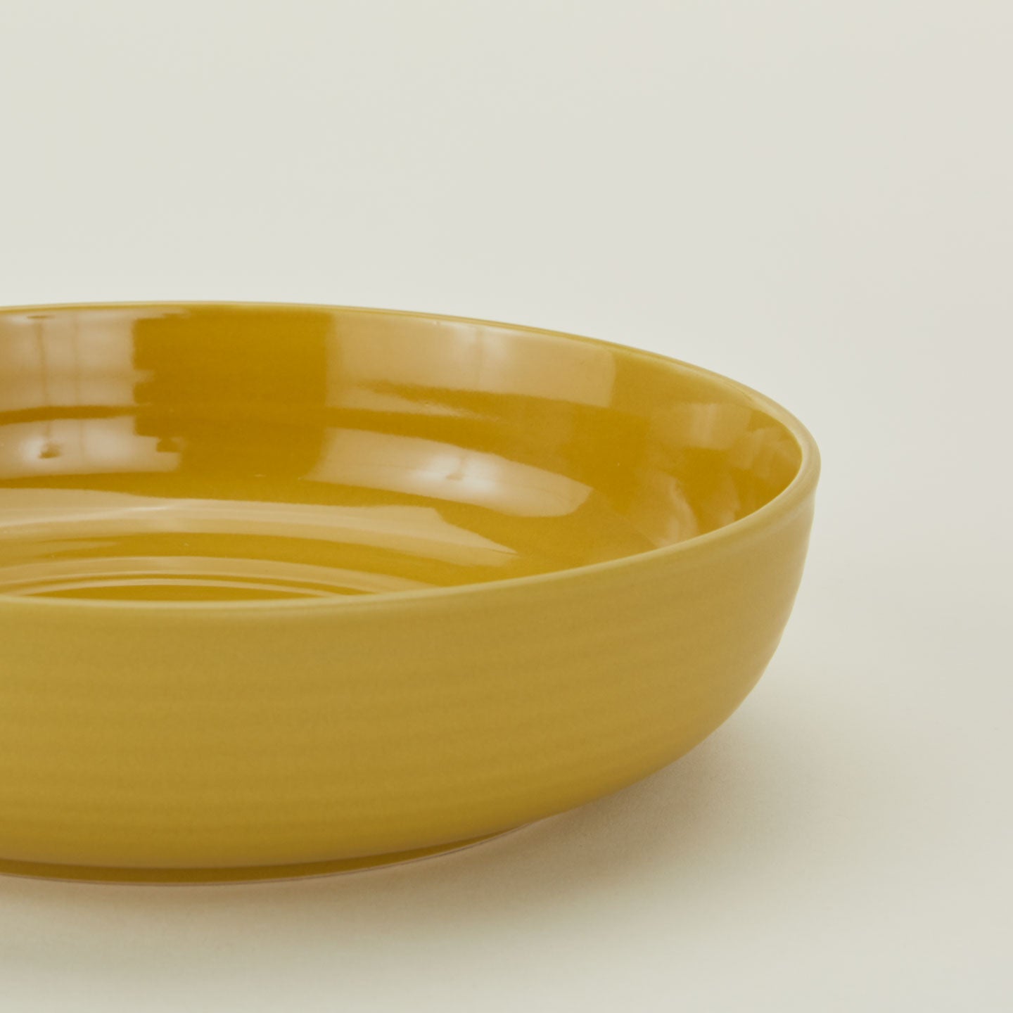 Close up of Essential Low Bowl in Mustard.
