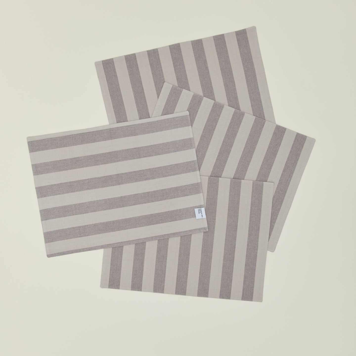 Set of four Essential Striped Placemats in Light Grey and Dark Grey.