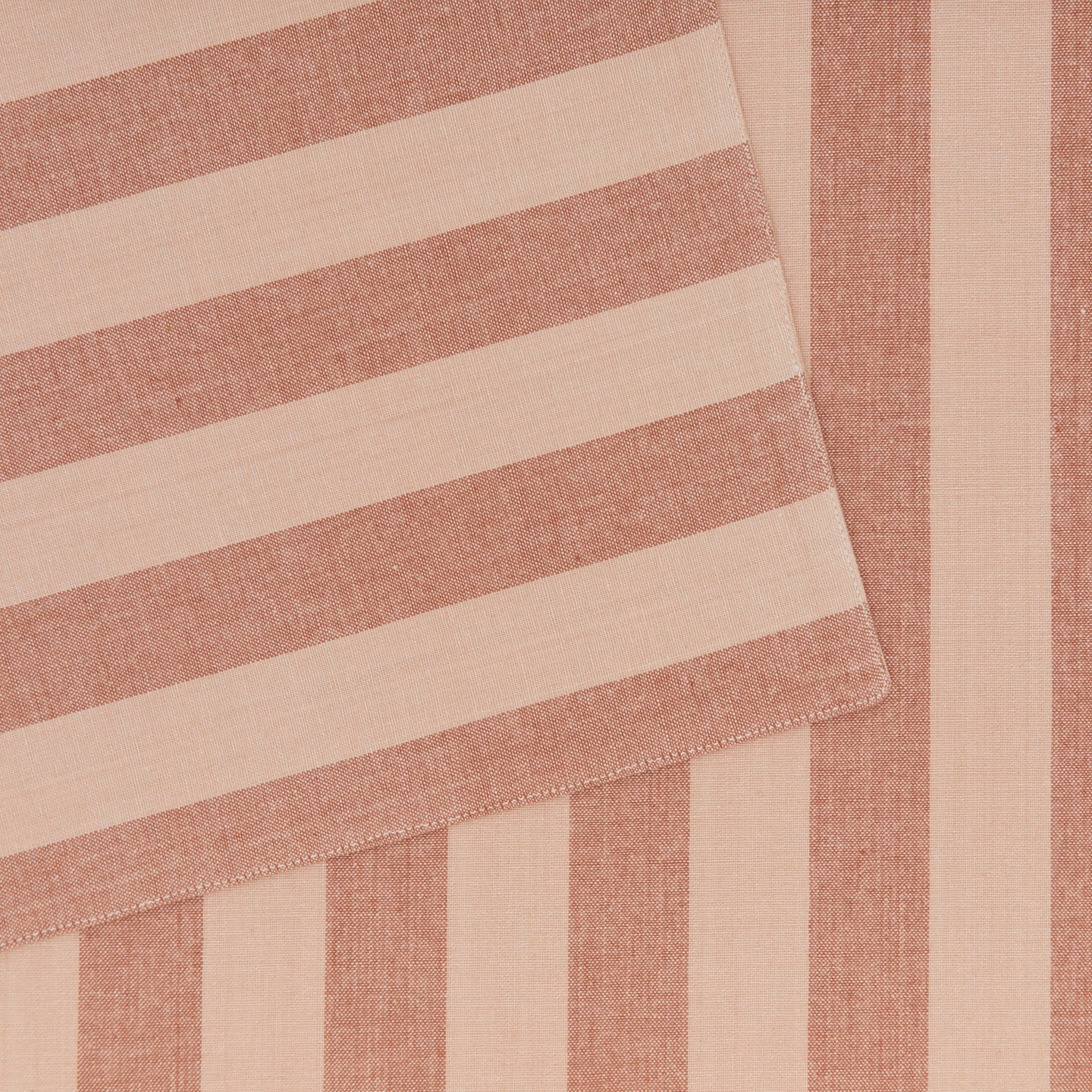 Close up of Essential Striped Placemat in Blush and Terracotta.