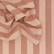 Close up of Essential Striped Dinner Napkin in Blush and Terracotta.