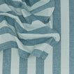 Close up of Essential Striped Dinner Napkin in Sky and Peacock.
