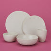 Group of Atelier Dinnerware including small bowl, medium bowl, salad plate, dinner plate and mug.