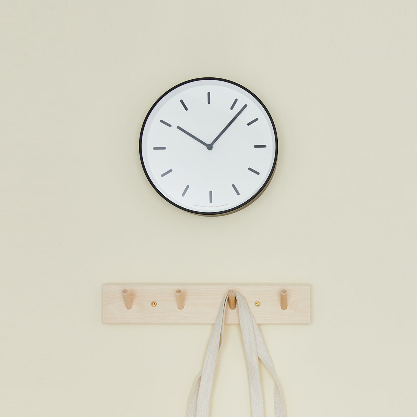 Graphic wall clock with coat hooks