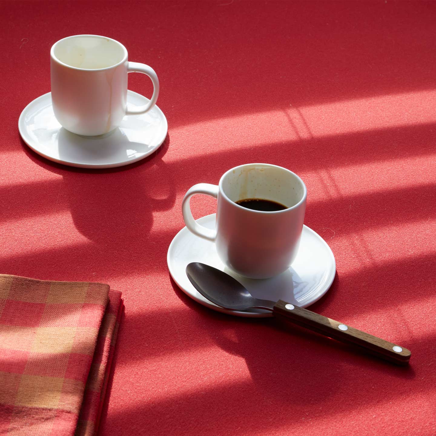 Simple Porcelain Espresso Mugs with spoon and Gingham Napkin.