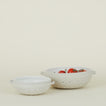 Large and small colander with tomatoes