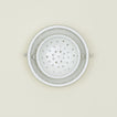 Overhead view of large and small colander nested 
