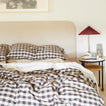 Essential Gingham bedding in Black on bed with nightstand.