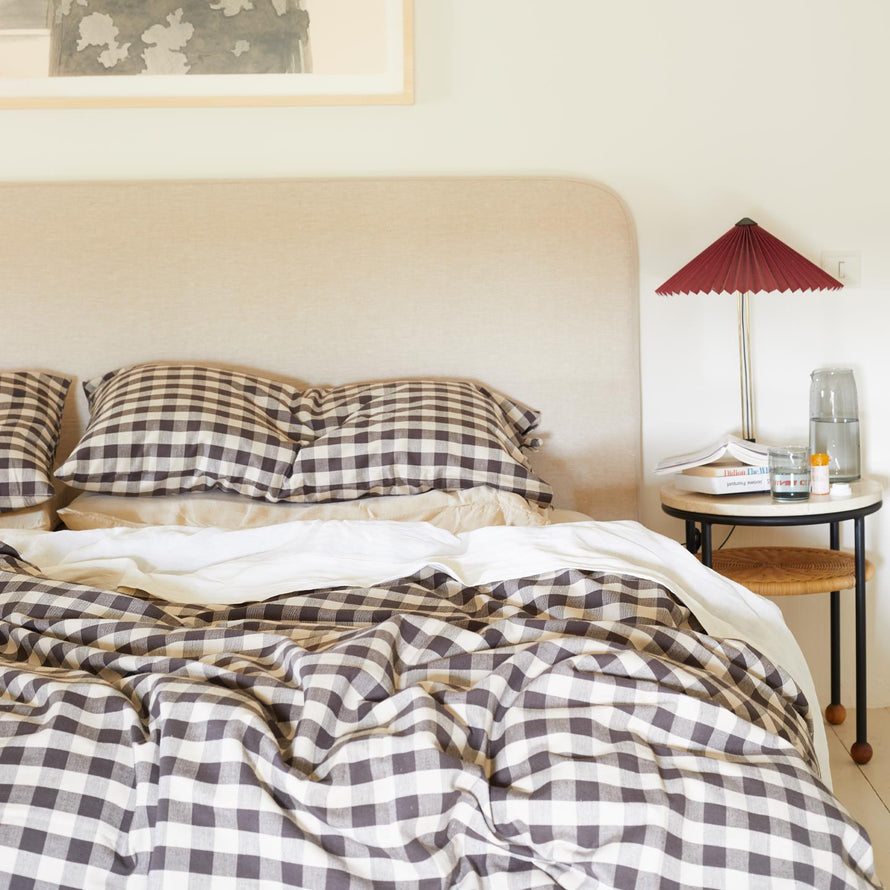 Essential Gingham bedding in Black on bed with nightstand.