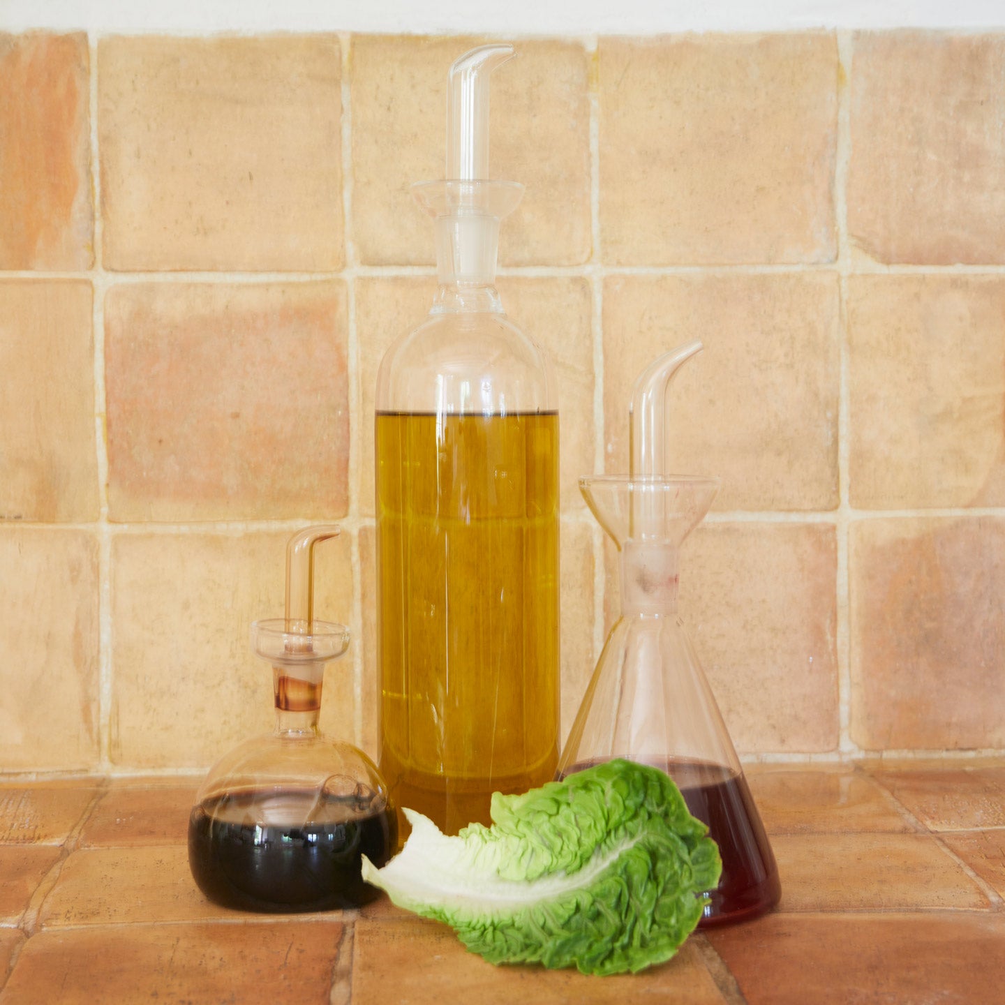 Essential kitchen bottles with lettuce