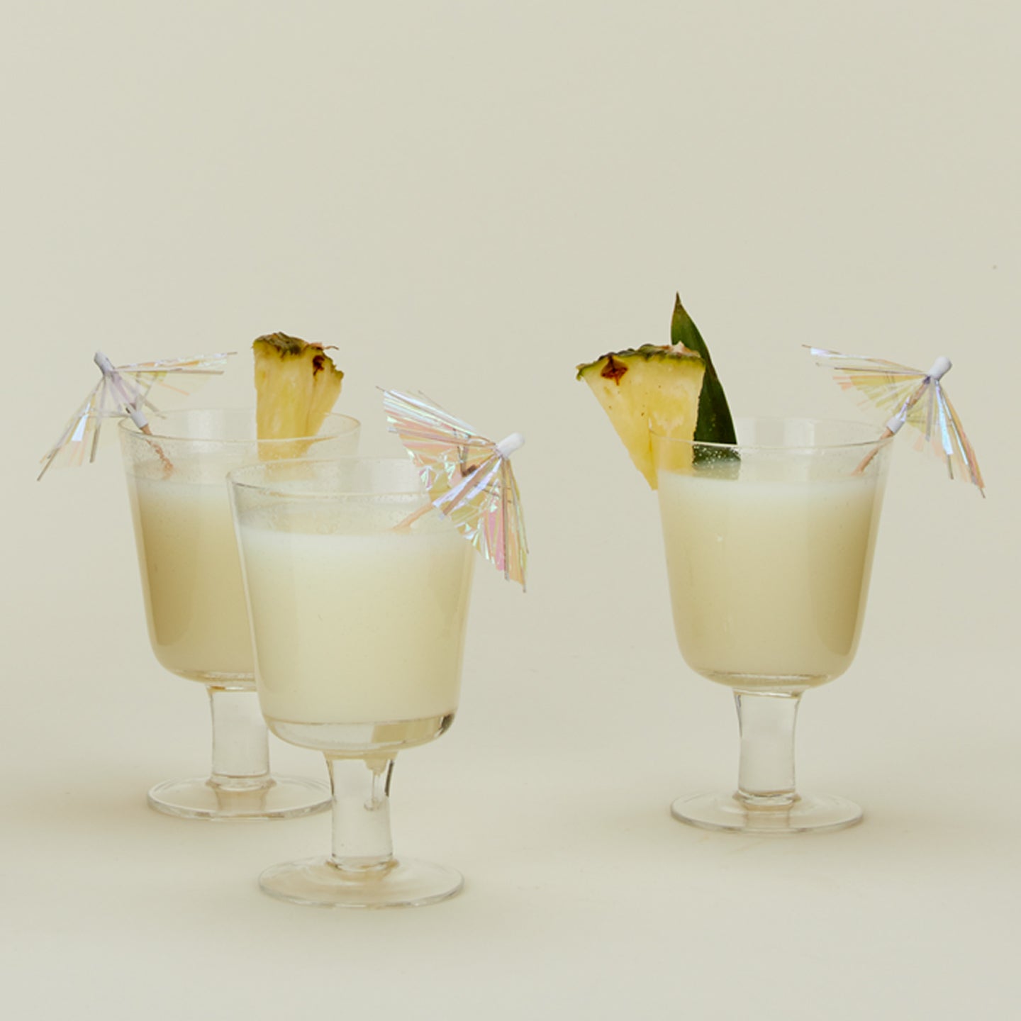 Iridescent cocktail umbrellas in drinks