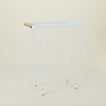 A  modern slim rolling laundry basket.