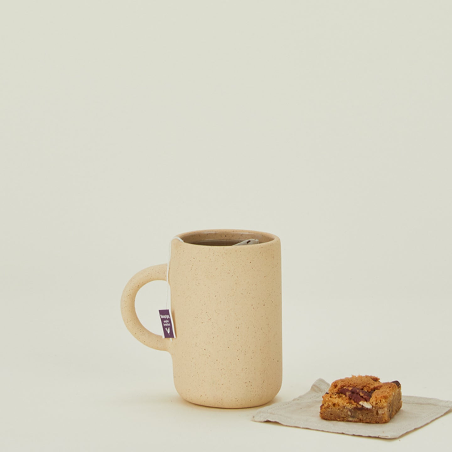 Al Centro Ceramica cylinder mug with tea and pastry