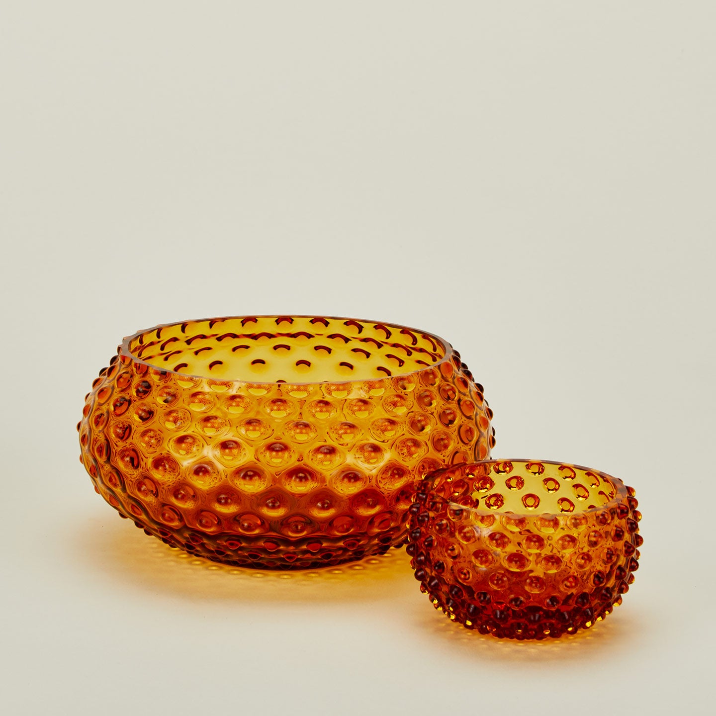 Glass hobnail amber serving and tapas bowls.