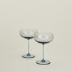 Set of two ribbed blue coupe glasses.