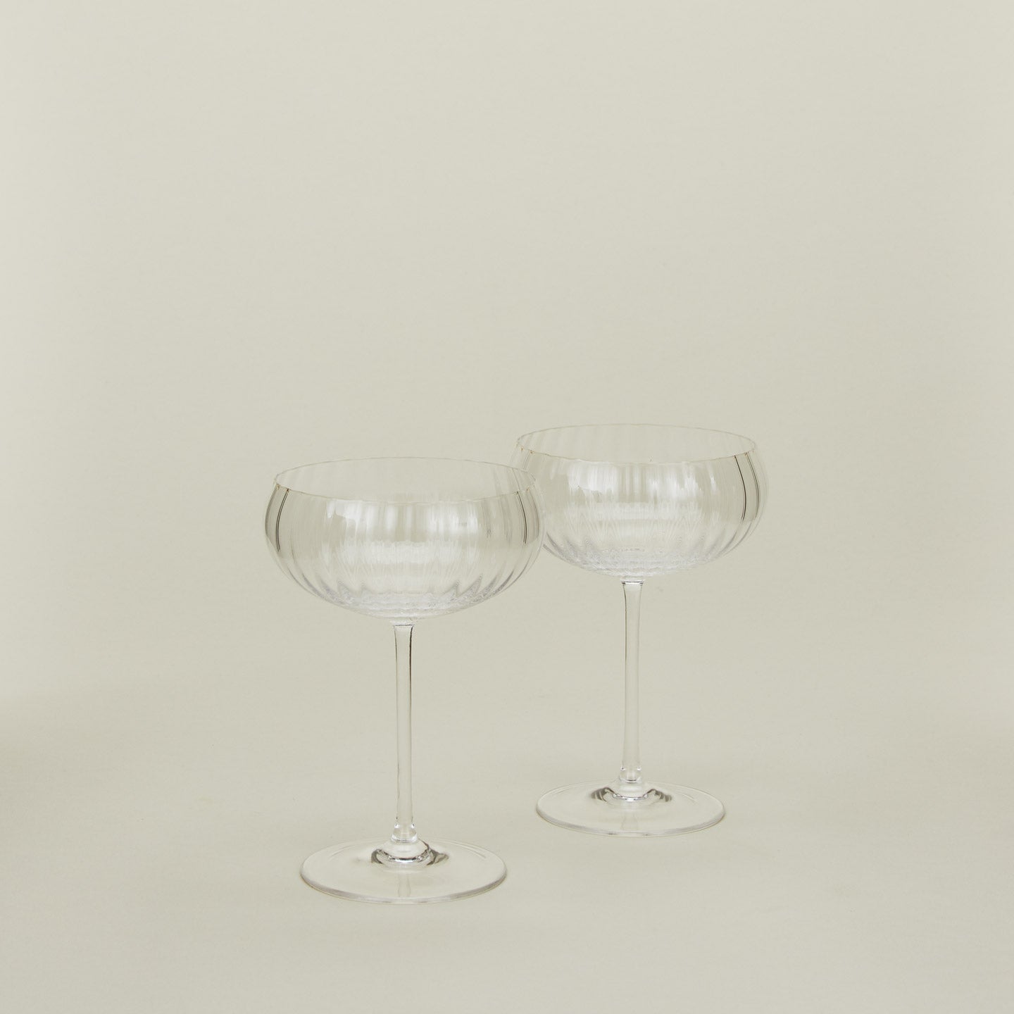 Set of two ribbed clear coupe glasses.