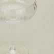Close up of ribbed clear coupe glass.