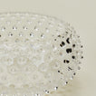 Close up of glass hobnail clear serving bowl.