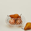 Glass hobnail clear serving bowl with pears.