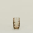 Textured grey glass tumbler.