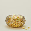 Glass hobnail grey serving bowl with popcorn.