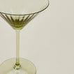 Close up of ribbed olive martini glass.