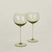 Set of two ribbed olive wine glasses.