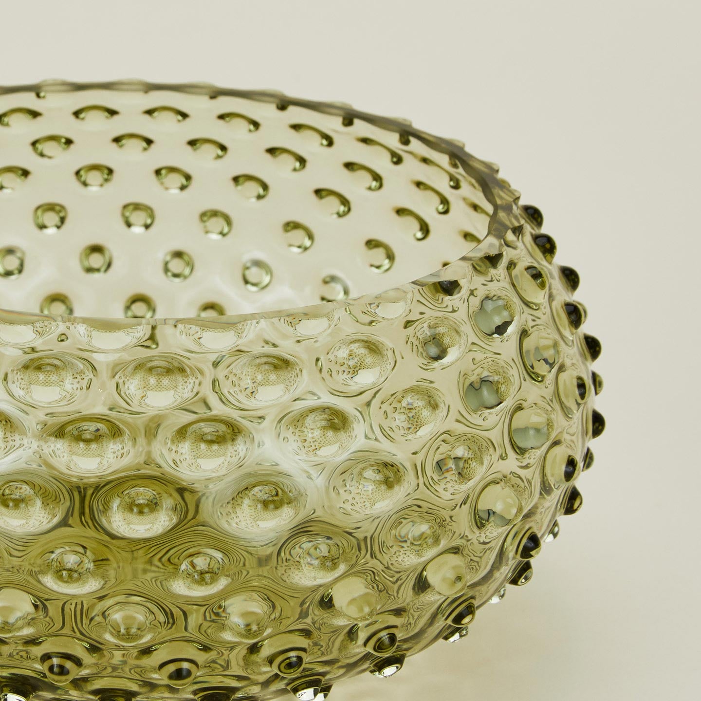 Close up of glass hobnail olive serving bowl.