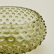 Close up of glass hobnail olive serving bowl.