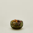 Glass hobnail olive tapas bowl with olives.