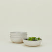 Four Atelier Medium Bowls, with lettuce.