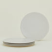 Four Atelier Dinner Plates.