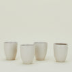 Four Atelier Mugs.