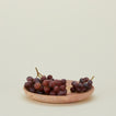 Red travertine tray with grapes