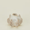 Close up view of  short Brutalist candle holder 
