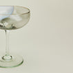 Close up view of Bow Glassworks coupe in white and grey