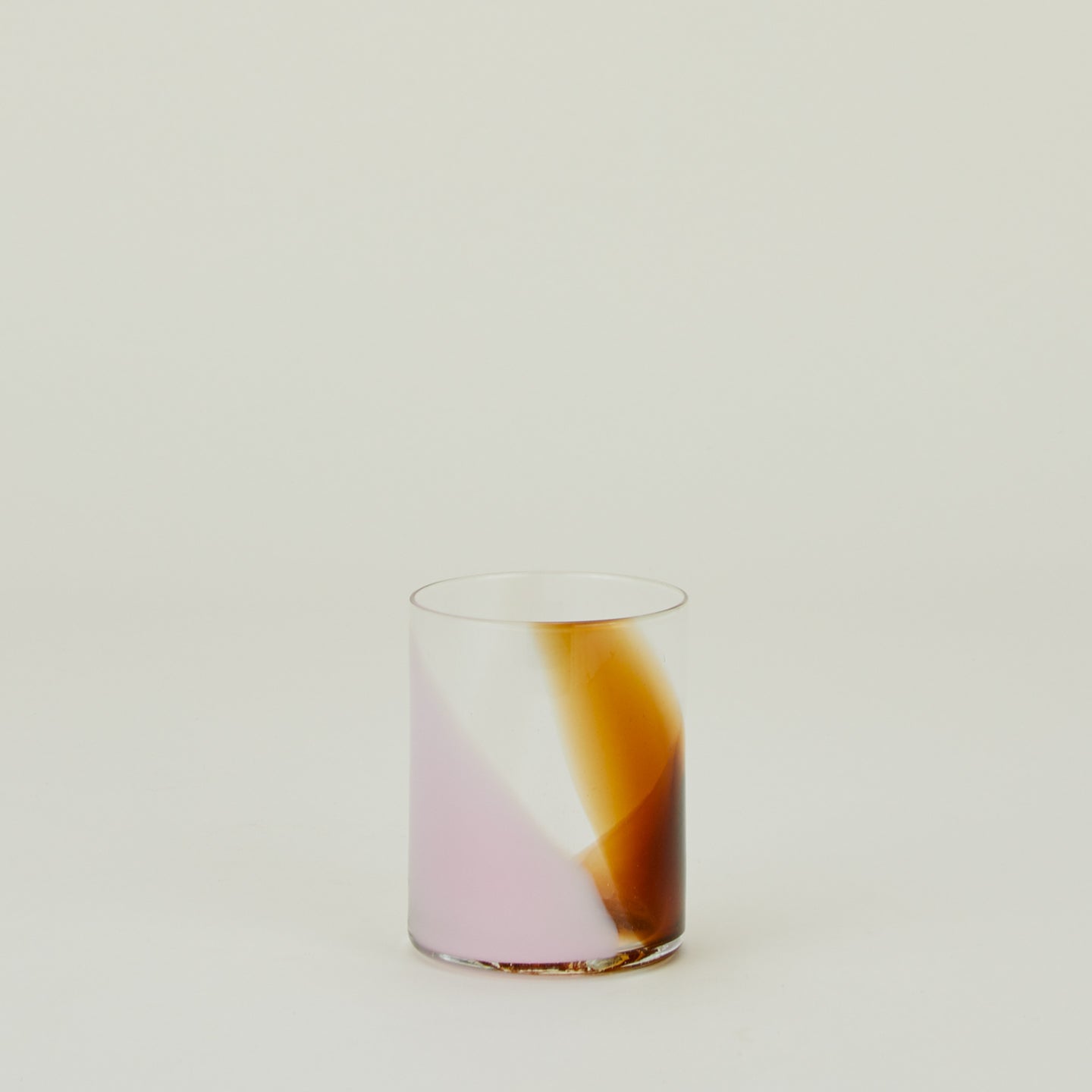 Blown Glass Tumbler with blush and amber swirl pattern.