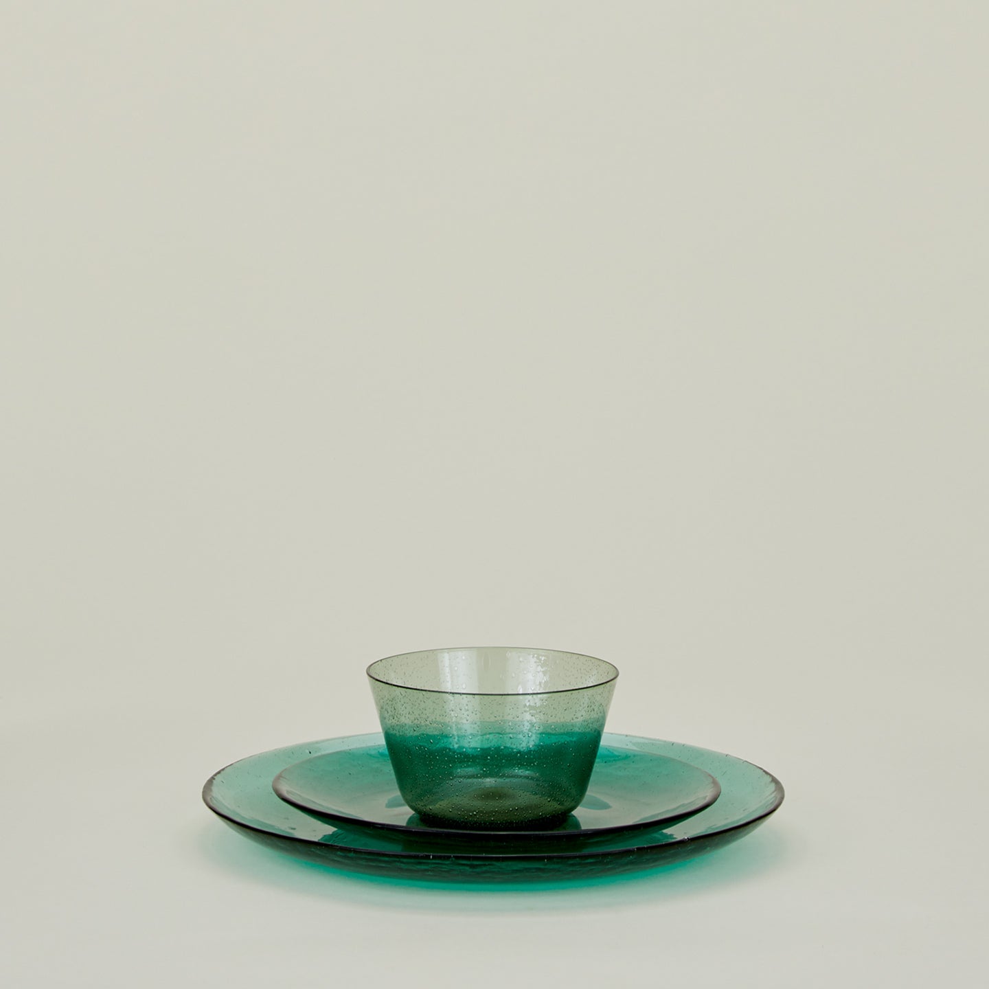 Group of Jade glass dinner plate, salad plate and bowl.